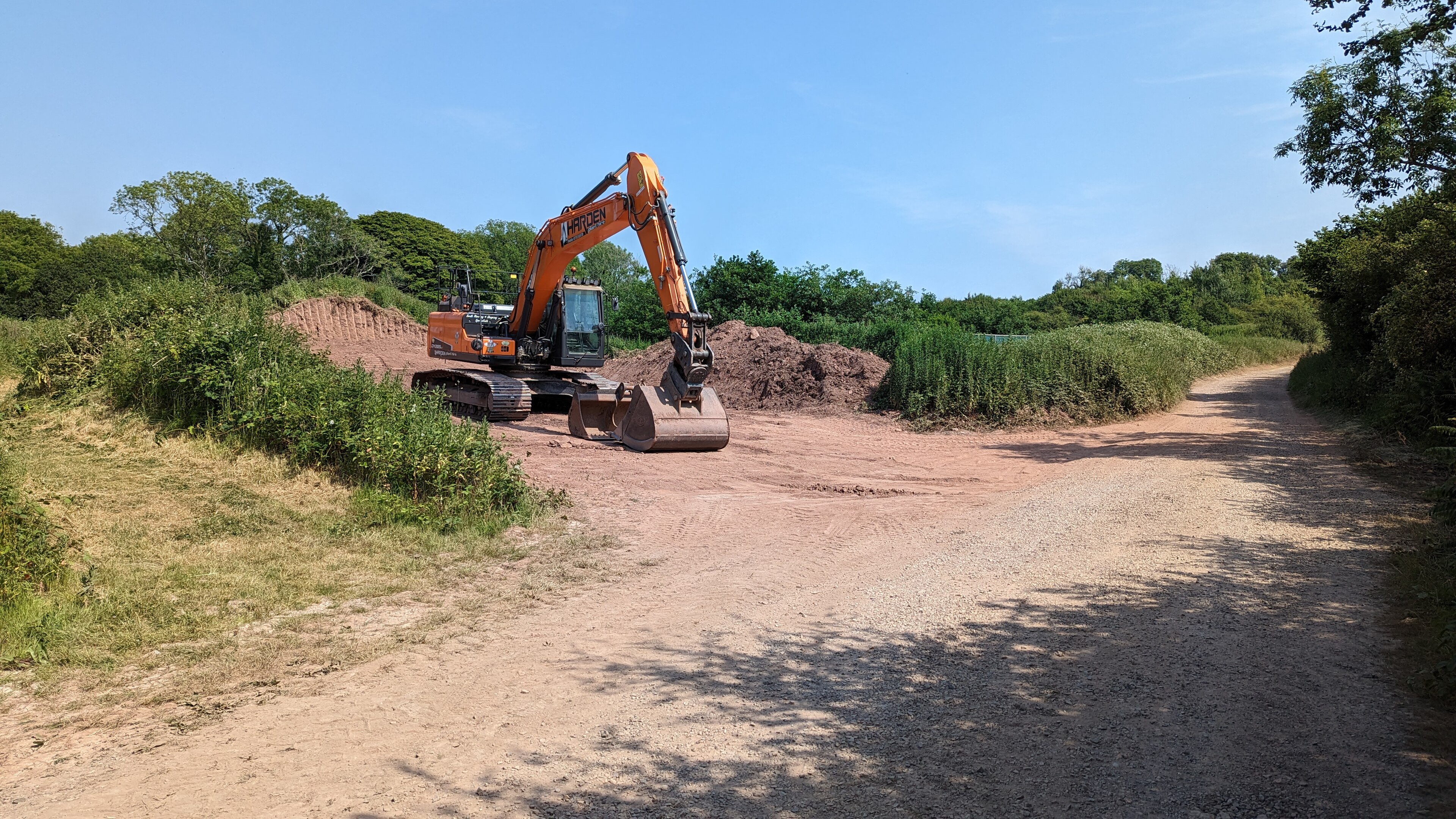 Excavator-led sitework supporting institutional and civil expansion activity
